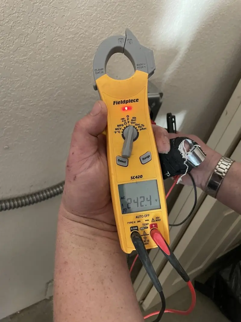 Voltage testing with clamp meter during Outlet Installation in Carbondale